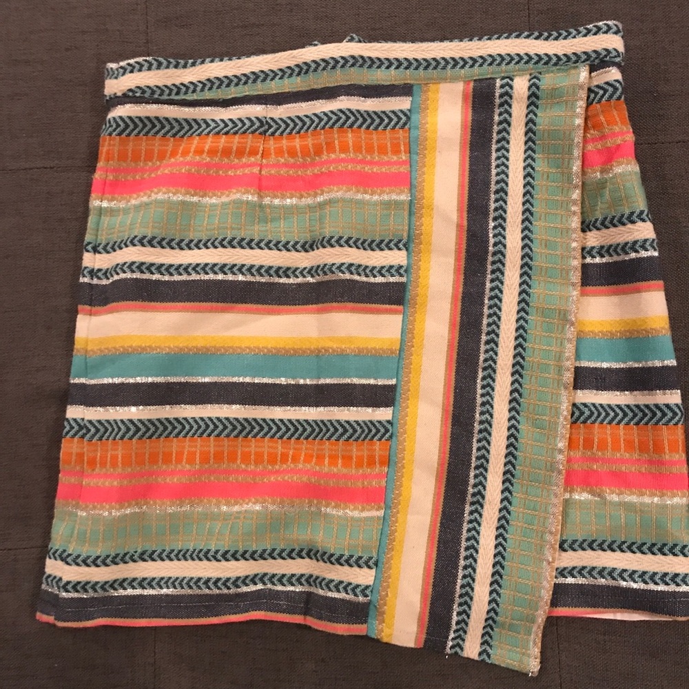 Mini skirt (Knit). Faux wrap style.